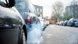 Car on the road with fumes