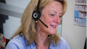 Woman taking a call with a headset
