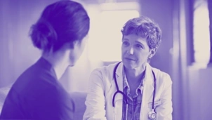 A doctor speaking to a patient
