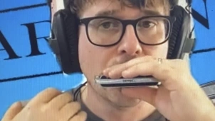 A man playing harmonica