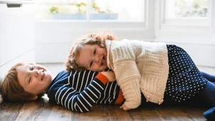 Two kids cuddling