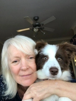 A woman holding a dog