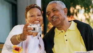 Two people taking photo