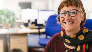 Woman smiling with headset