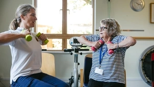 Two people doing chair exercises