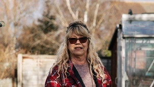 Woman standing in allotment