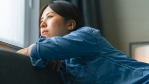 Person looking out window
