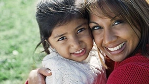 Parent and child smiling
