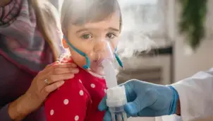 Child wearing an oxygen mask